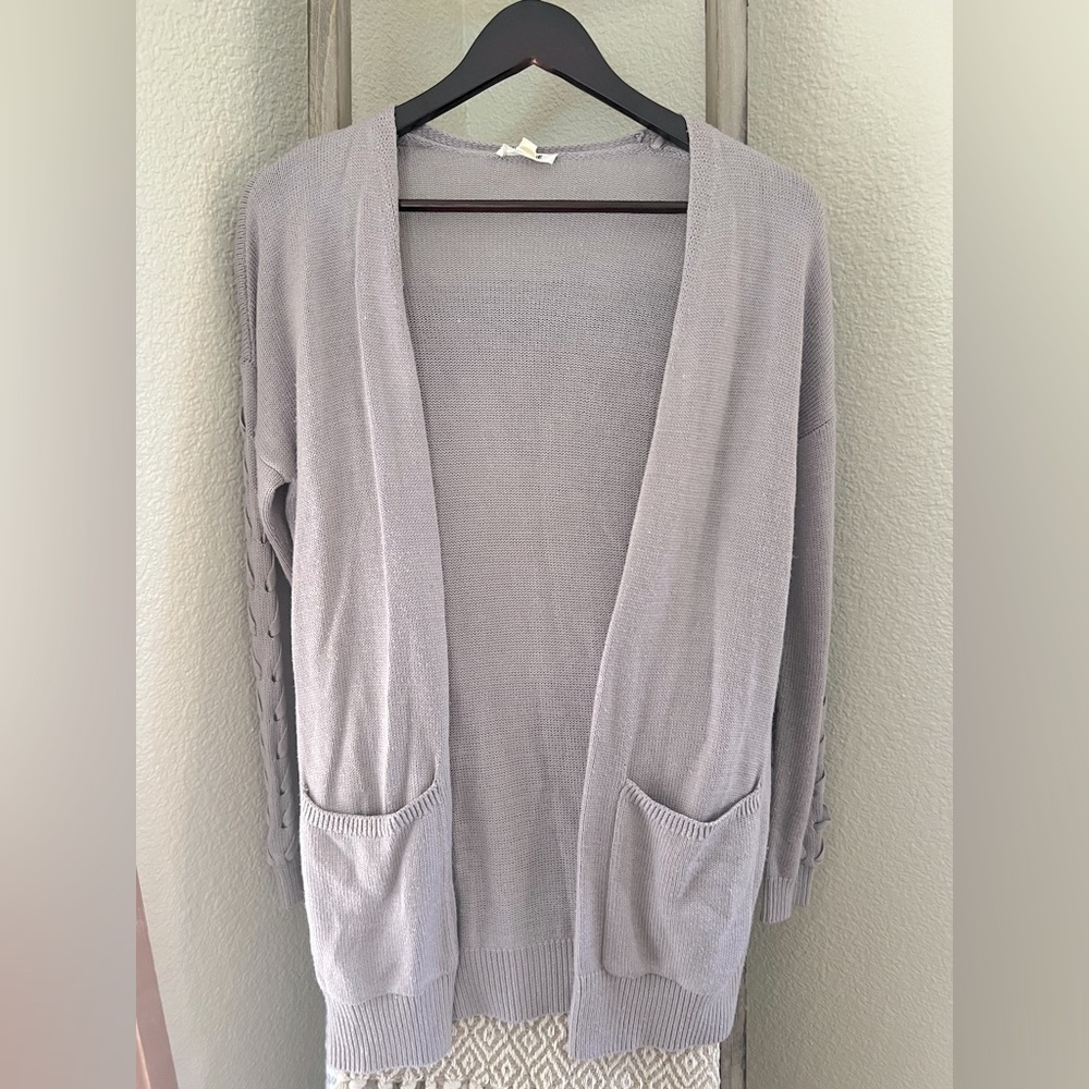 Light purple sweater with braided arm detail